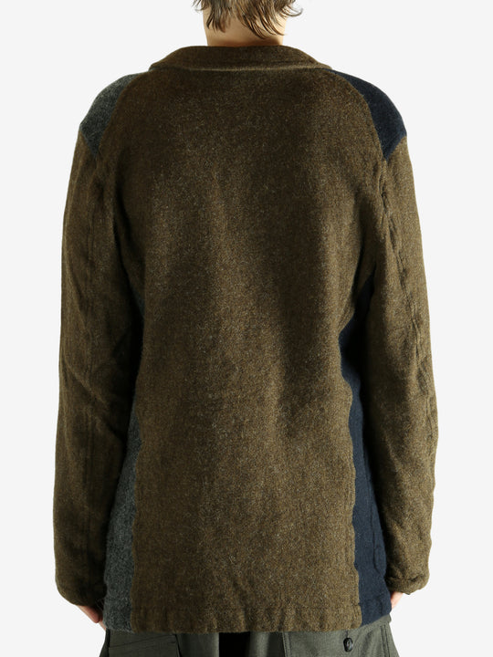 Brown jacket worn by a person. showing the jacket's fit