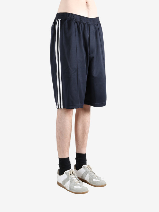 Navy shorts worn by a person, showing the shorts fit