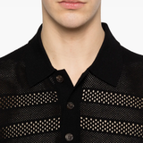 close up of black knitwear, showing texture of the viscose  fabric