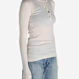 White T-shirt worn by a person, showing the shirt's fit