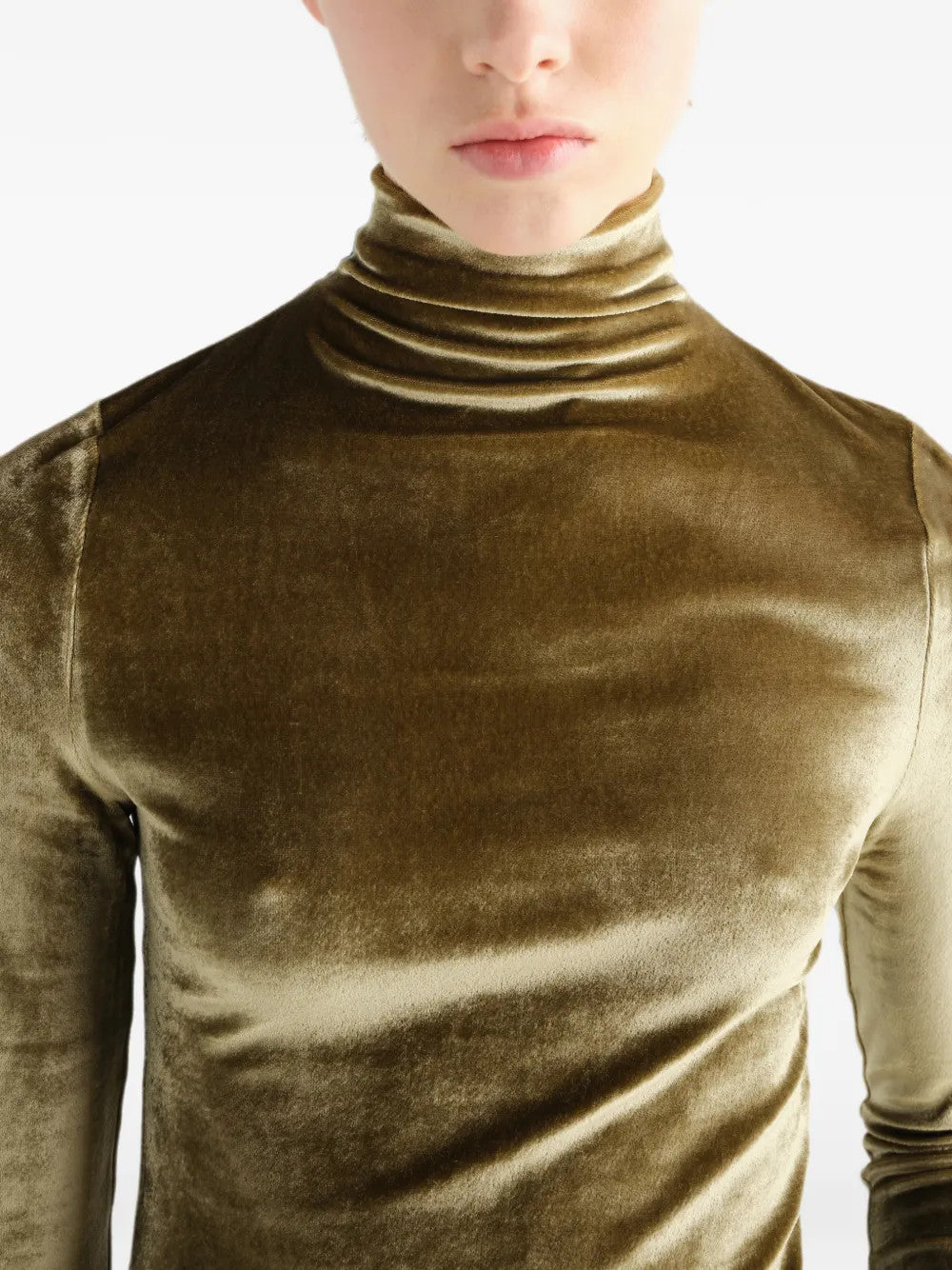 Green top worn by a person, showing the top fit