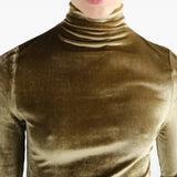 Green top worn by a person, showing the top fit