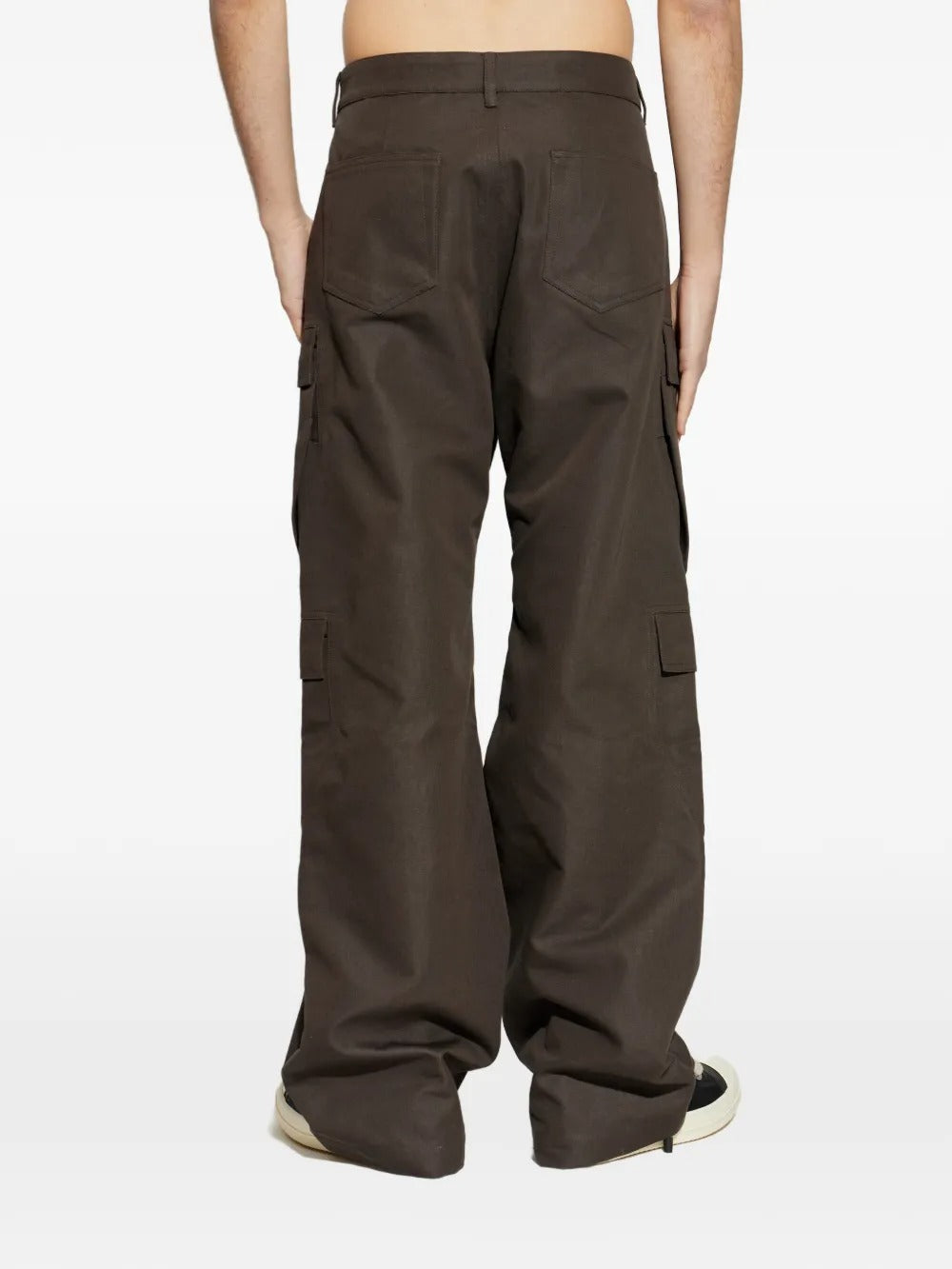 Brown pants worn by a person, showing the pants fit