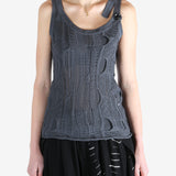 Blue tops worn by a person, showing the tops fit