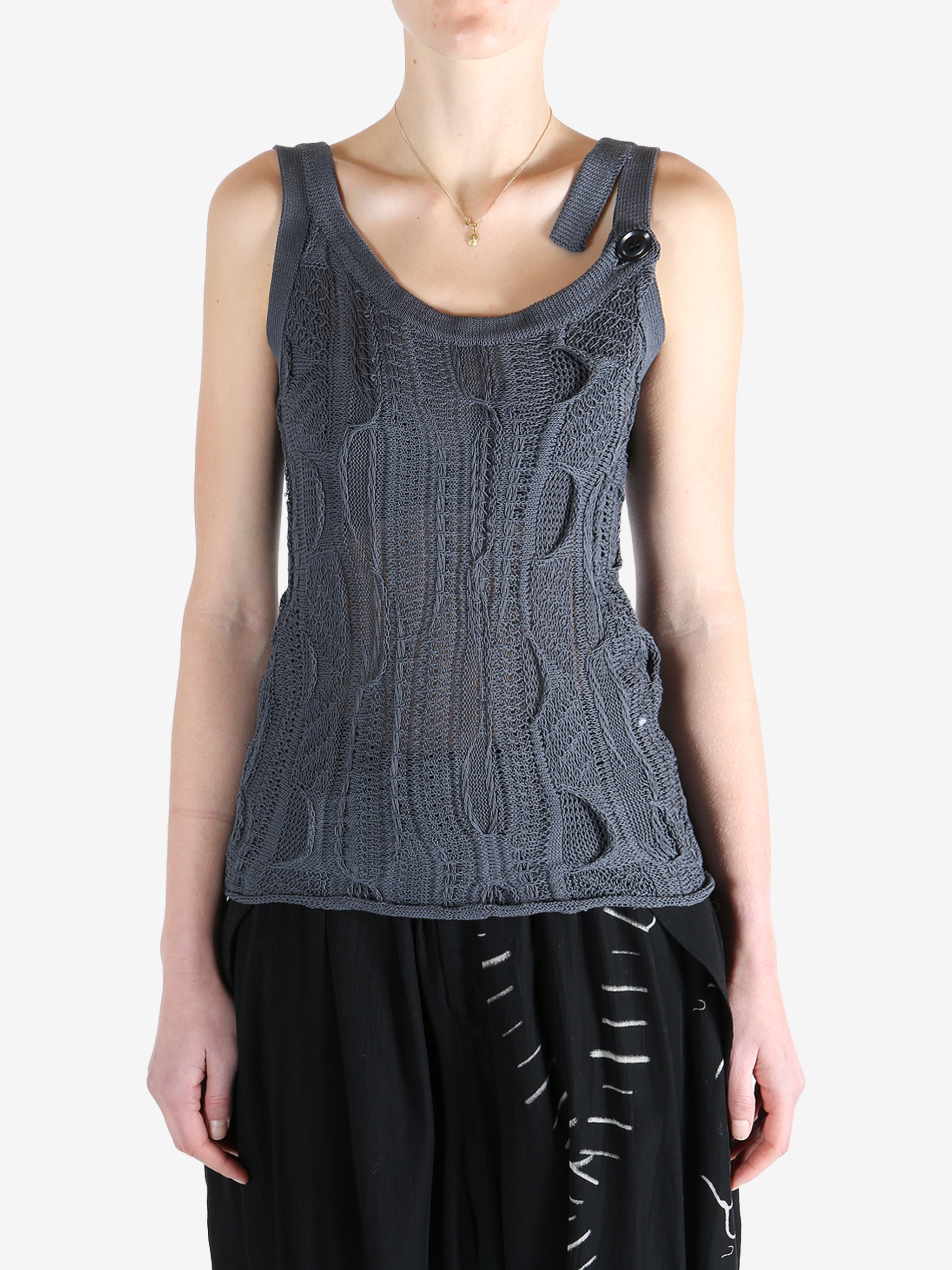 Blue tops worn by a person, showing the tops fit