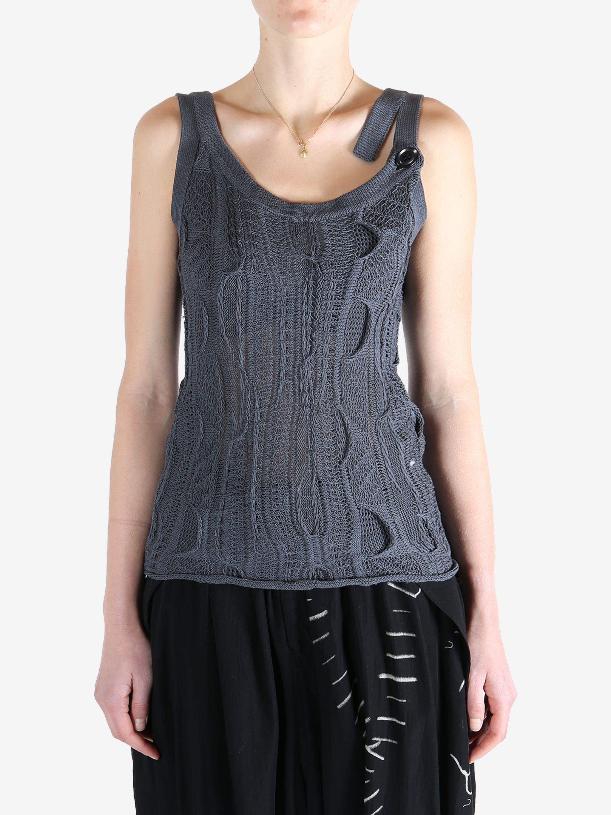 Blue tops worn by a person, showing the tops fit