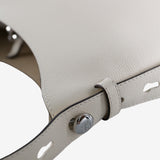 Close up of the white bag, showing texture of the leather fabric