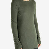 Green t-shirt worn by a person, showing the shirt's fit