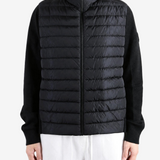 Black jacket worn by a person, showing the jacket fit