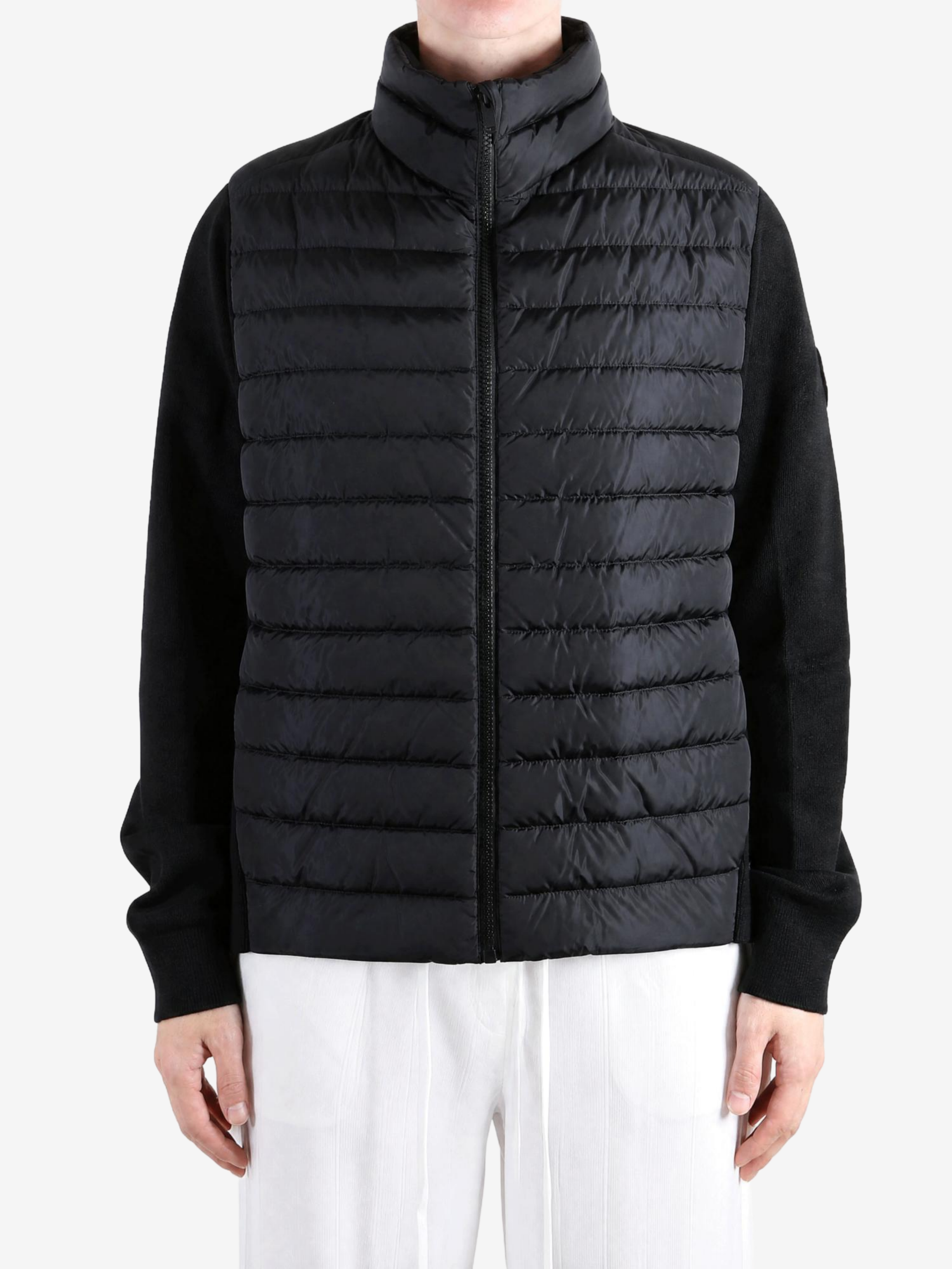 Black jacket worn by a person, showing the jacket fit