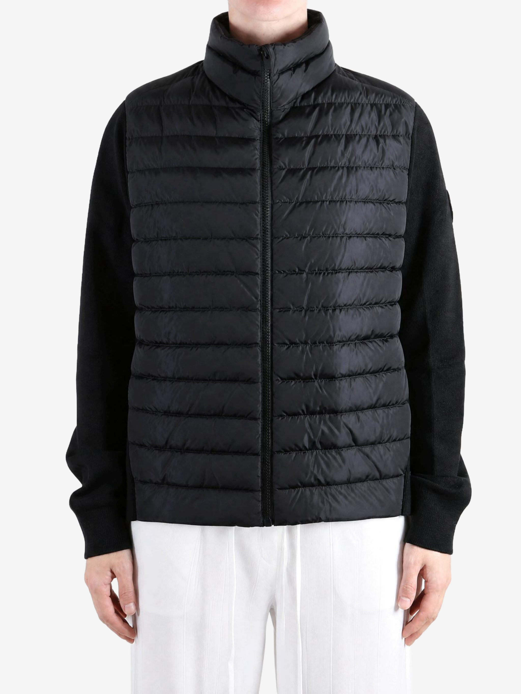 Black jacket worn by a person, showing the jacket fit