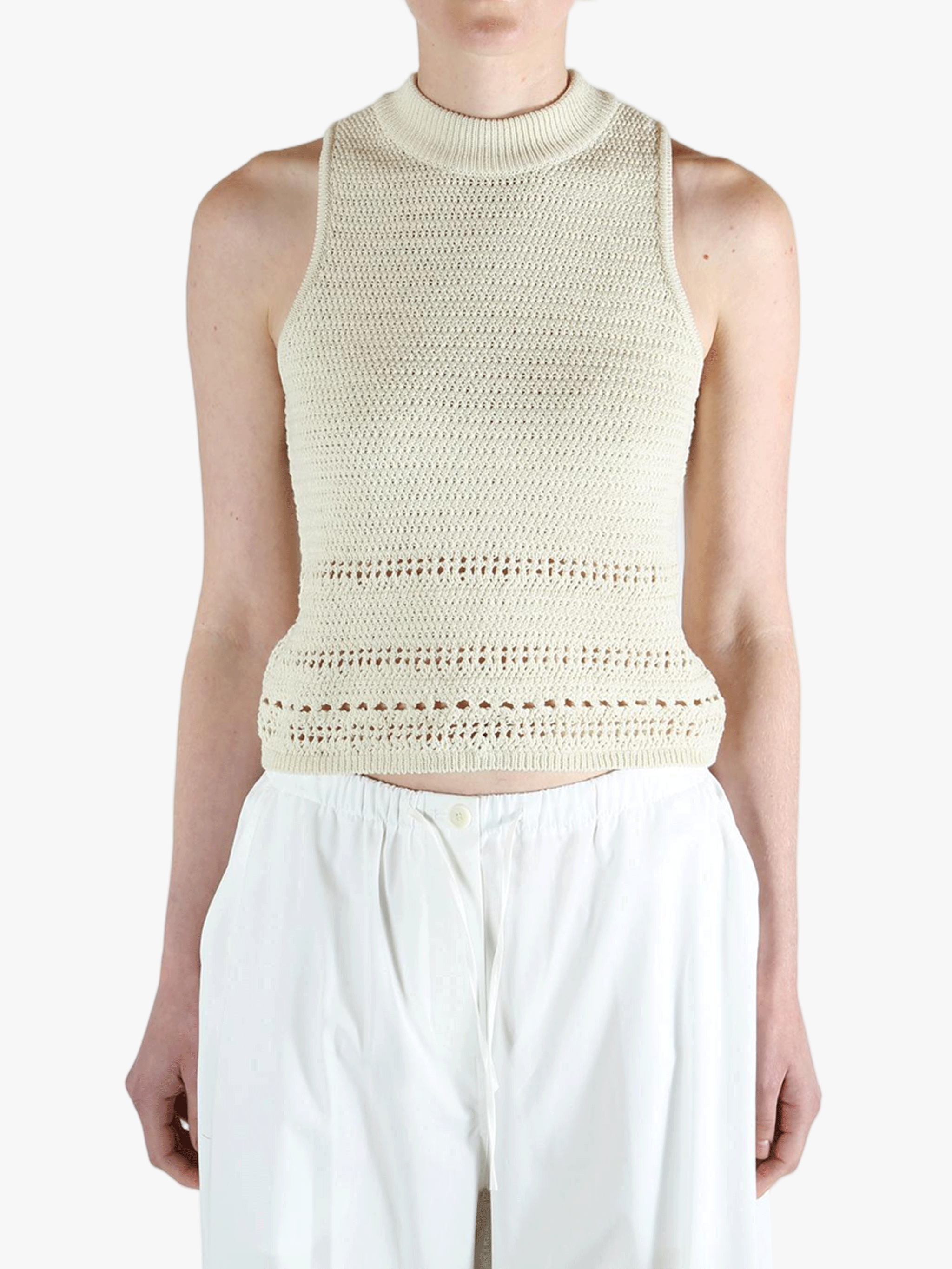 White vest worn by a person, showing the vest's fit