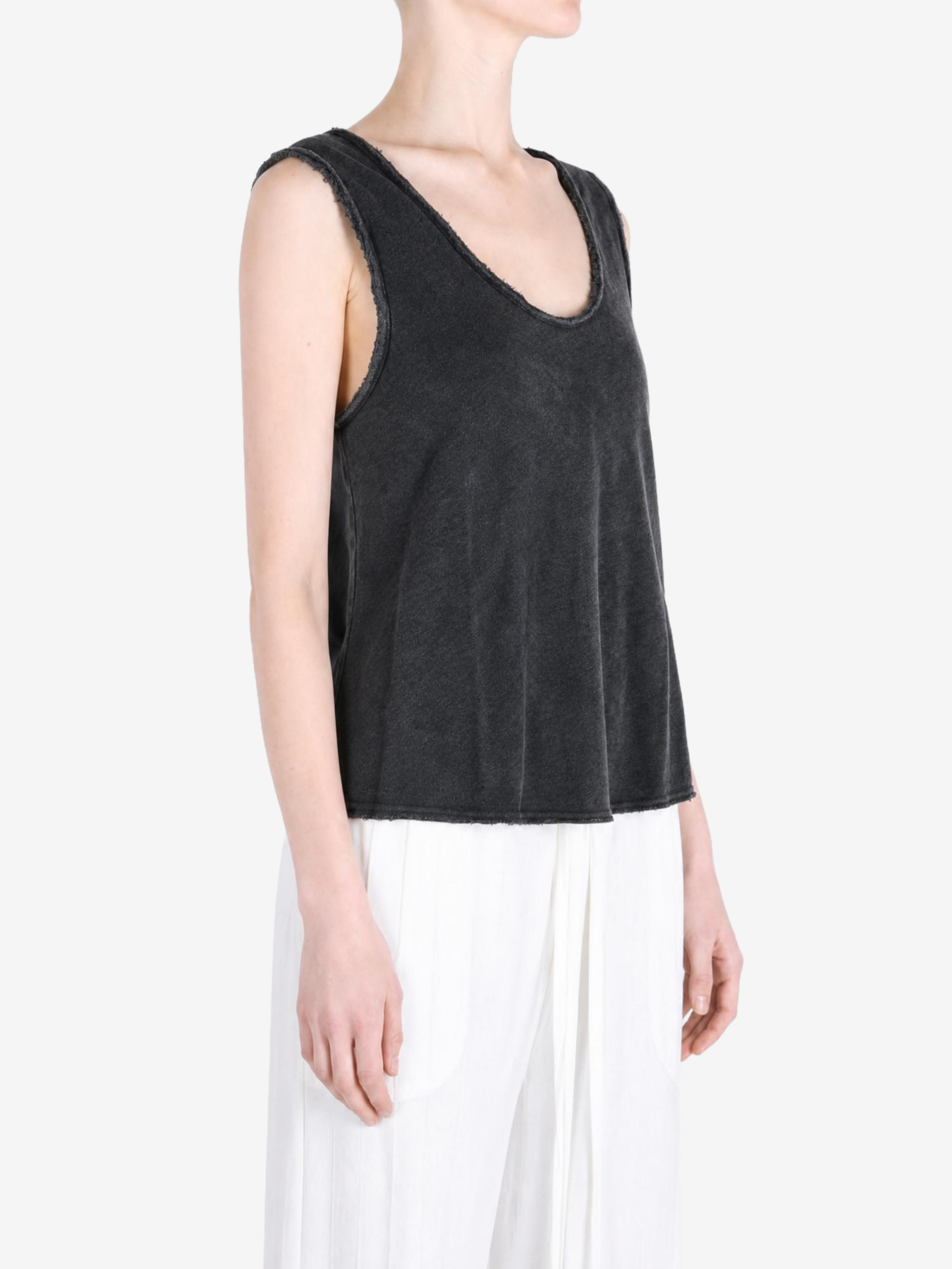Black top worn by a person, showing the top fit