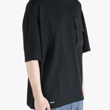 Black t-shirt worn by a person, showing the shirt's fit