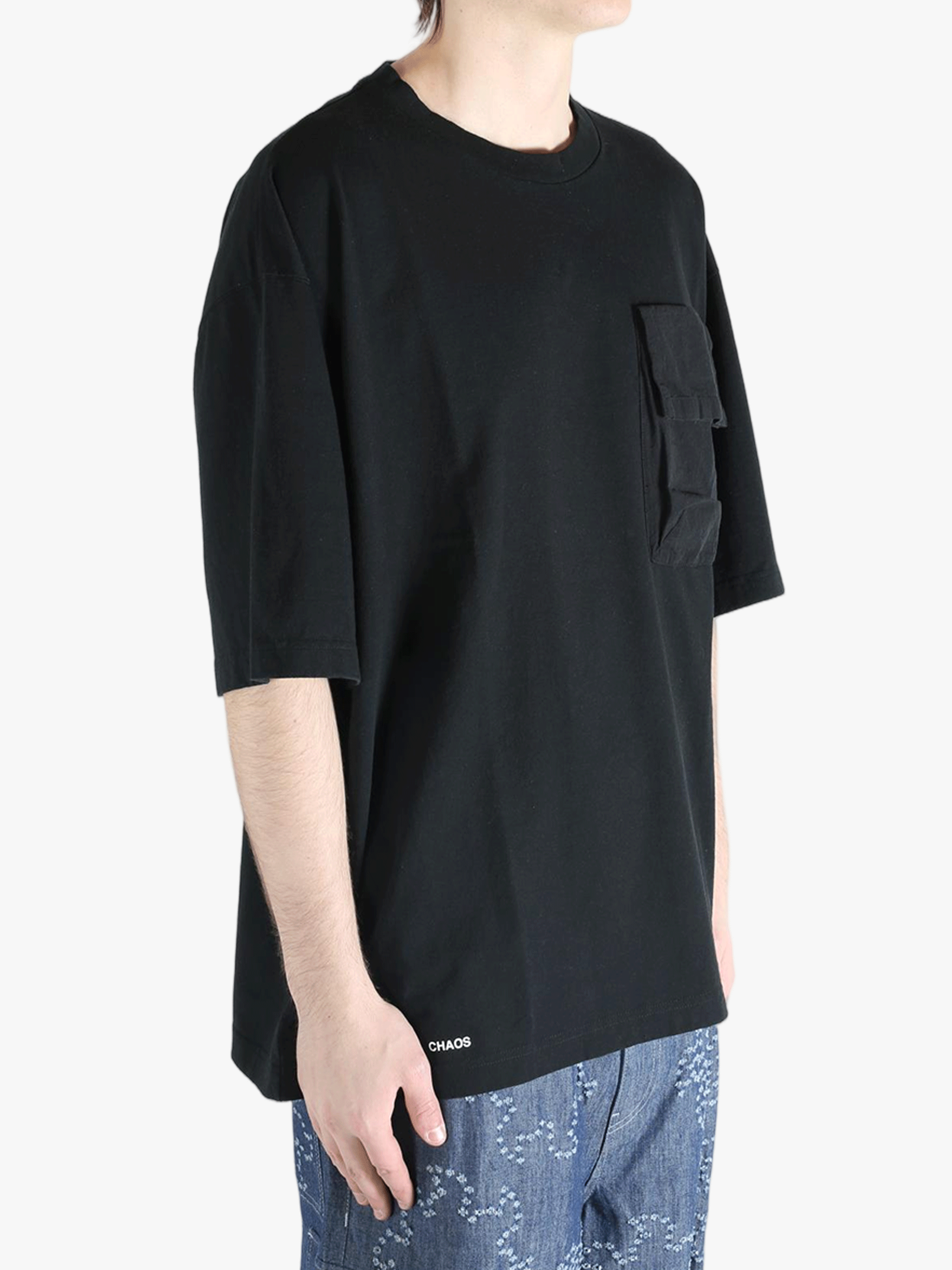 Black t-shirt worn by a person, showing the shirt's fit