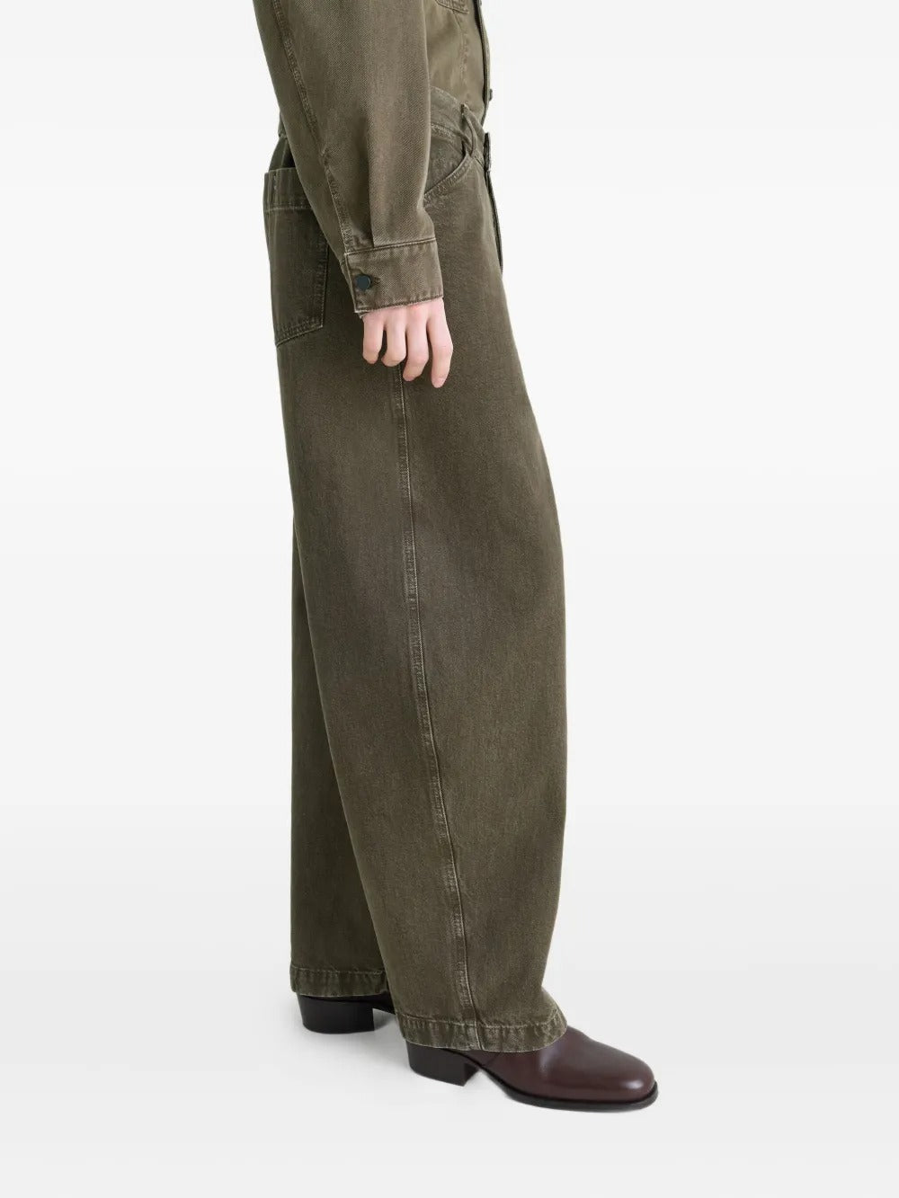 Green pants worn by a person, showing the pants' fit