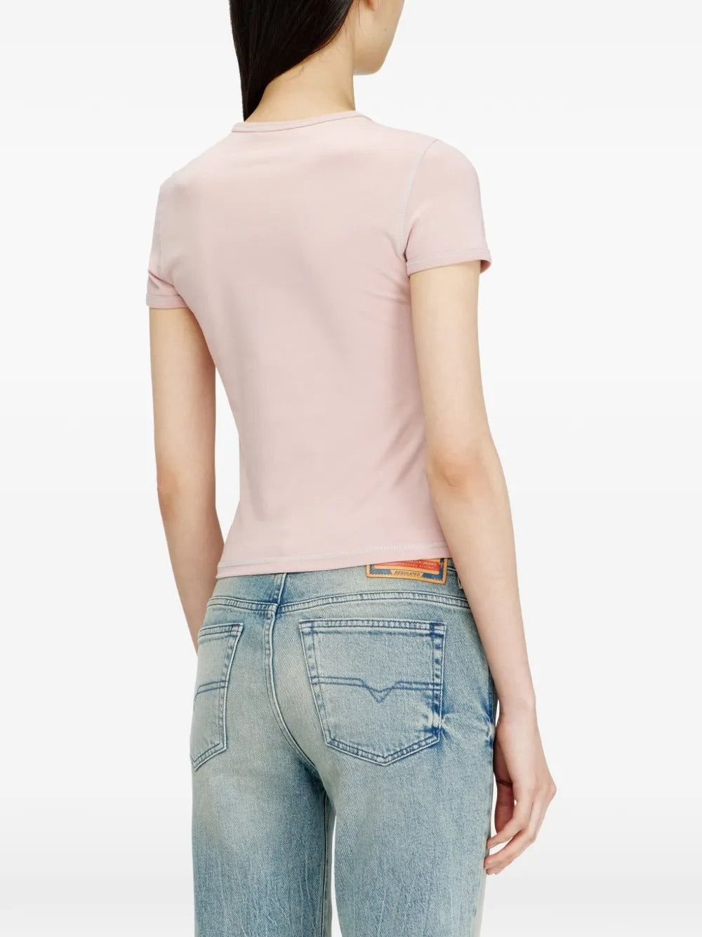 Pink t-shirts worn by a person, showing the t-shirts fit