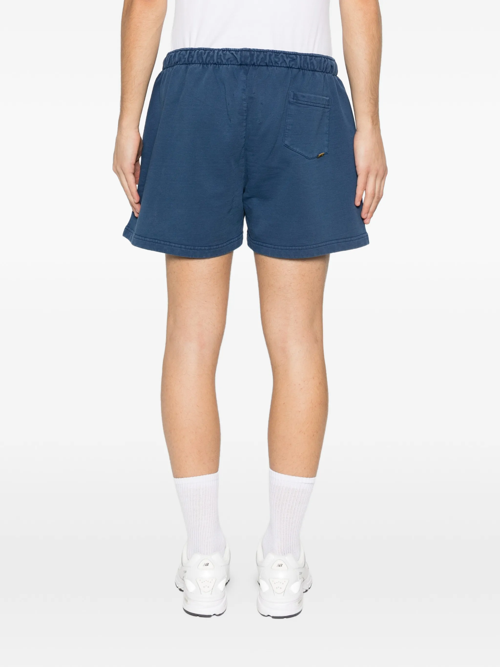 Blue shorts worn by a person, showing the pants's fit