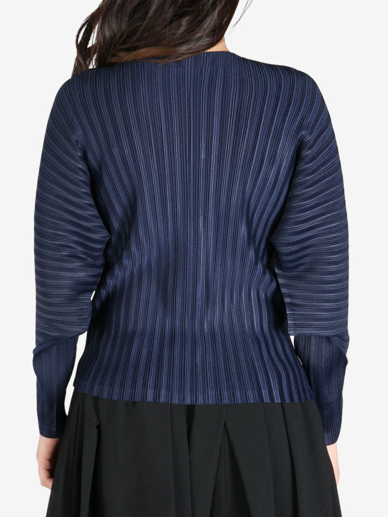 Navy cardigan worn by a person, back view