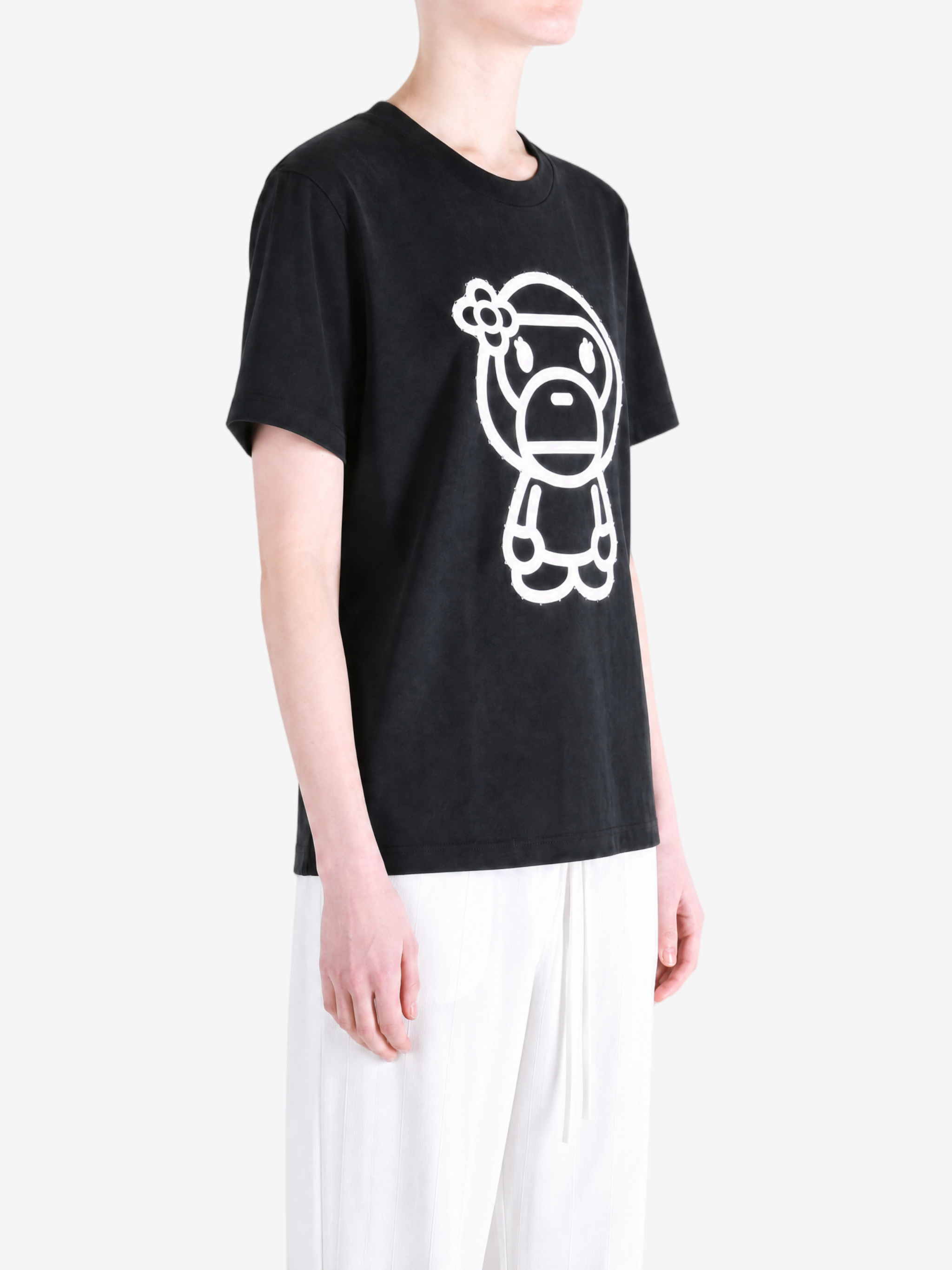 Black t-shirt worn by a person, showing the t-shirt fit