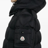 Black jacket worn by a person, showing the jacket fit