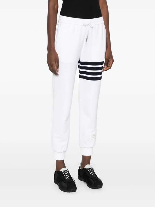 White pants worn by a person, showing the pants fit