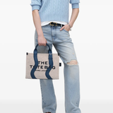 Navy bag,worn by a person, showing the bag fit