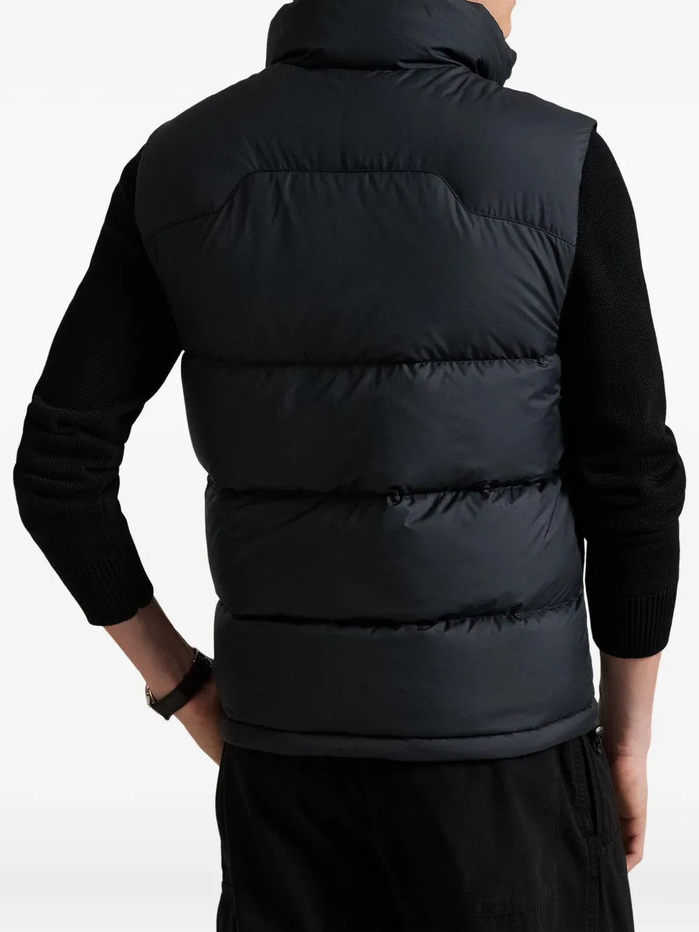 Black jacket worn by a person, showing the jacket fit