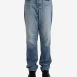Blue jeans worn by a person, showing the jeans's fit