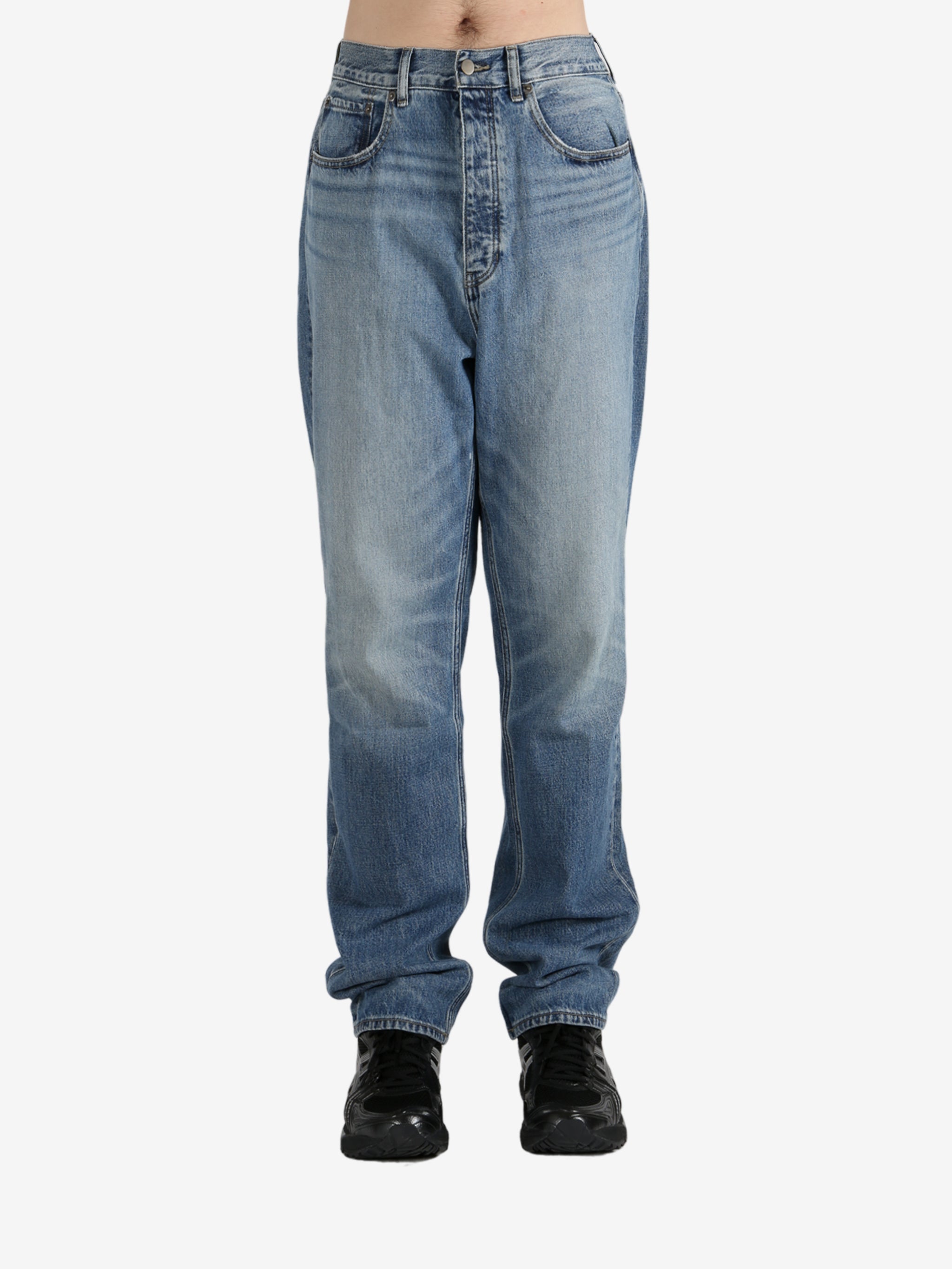 Blue jeans worn by a person, showing the jeans's fit