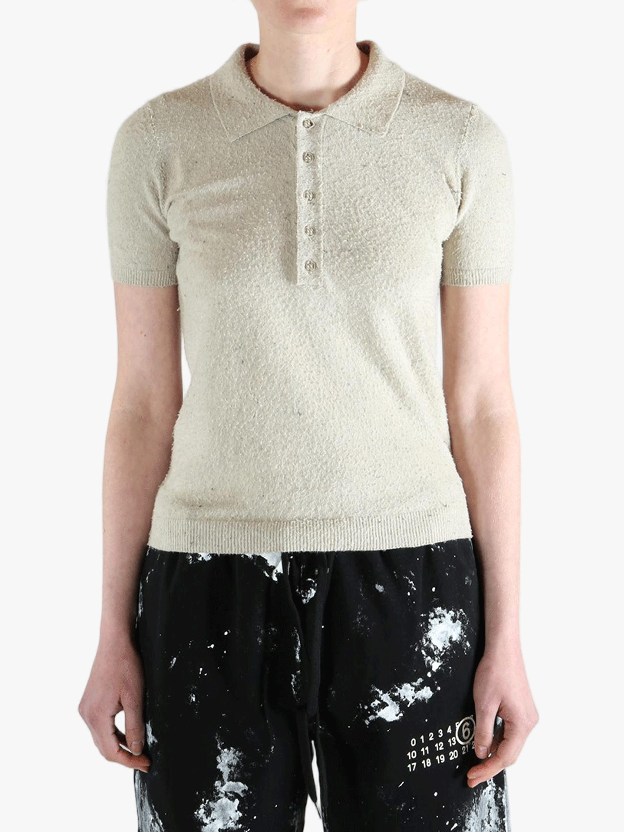 White t-shirts worn by a person, showing the t-shirts fit