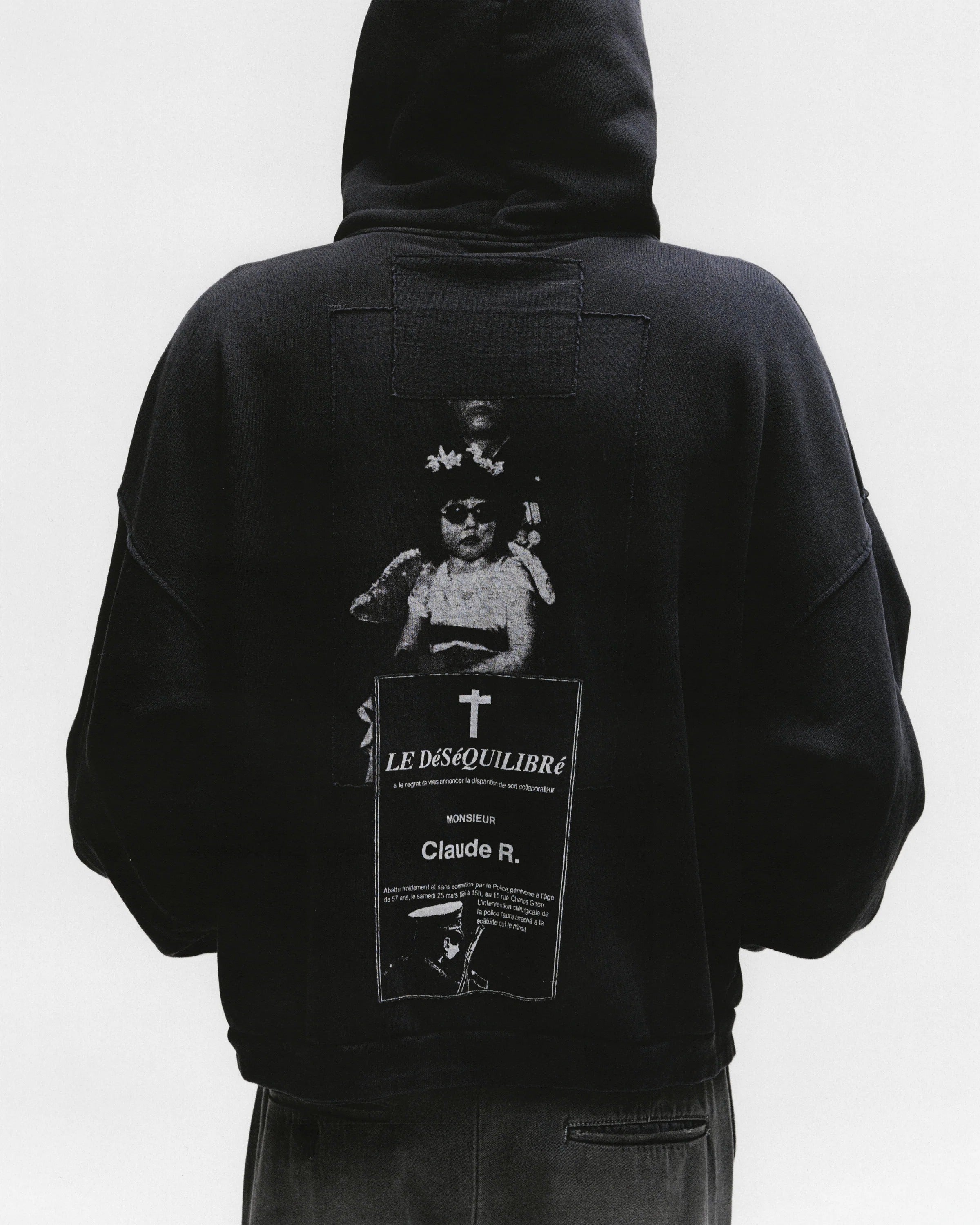 Black hoodies worn by a person, showing the hoodies fit