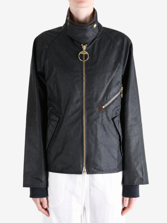 Black jacket worn by a person, showing the jacket fit