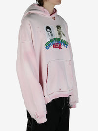 Pink sweatshirt worn by a person, showing the sweatshirt fit