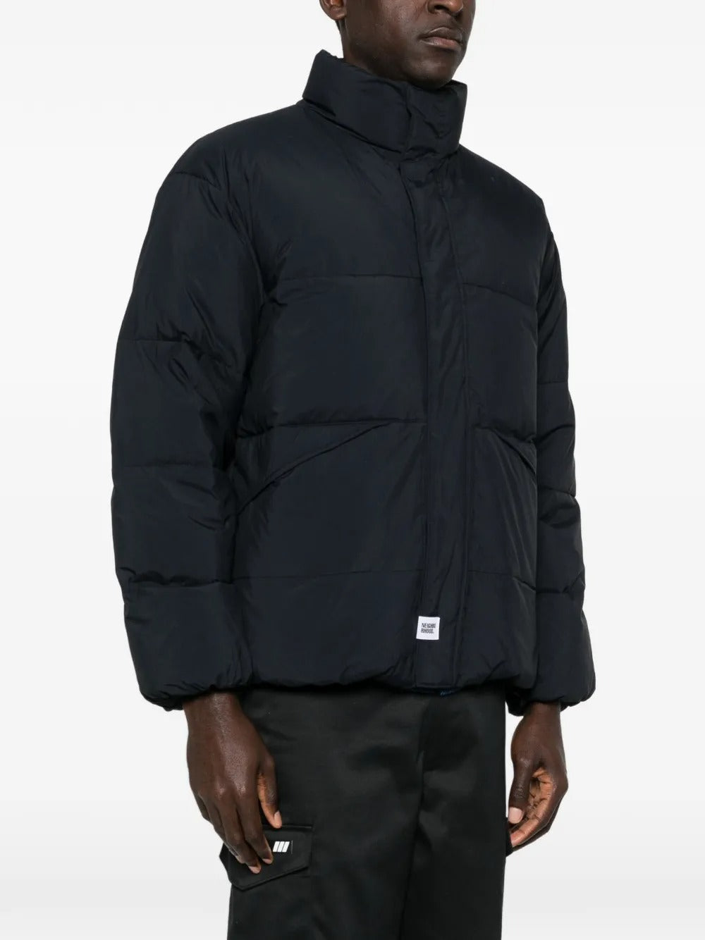 Black jackets worn by a person, showing the jackets fit