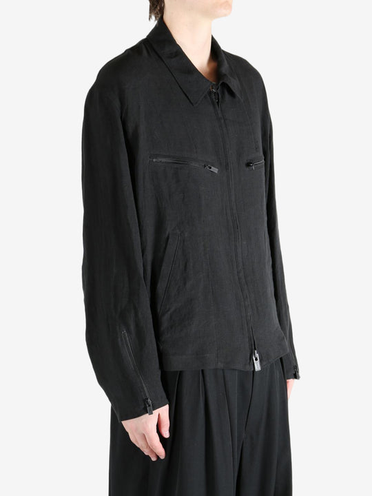 Black jacket worn by a person, showing the jacket's fit