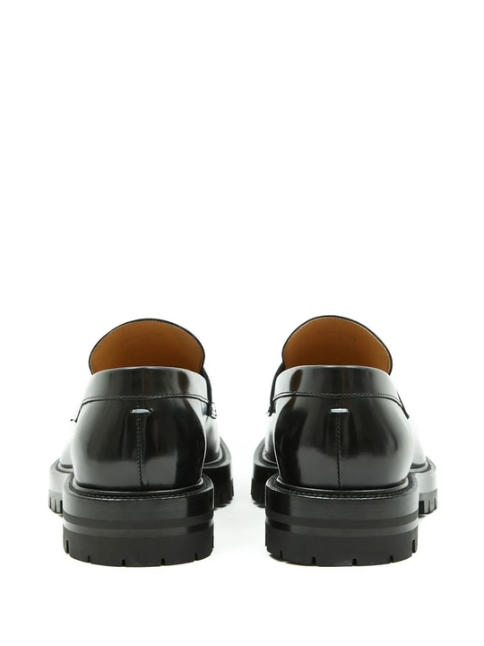 Black loafer, back view