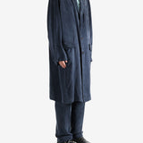 Navy coat worn by a person, showing the coat's fit