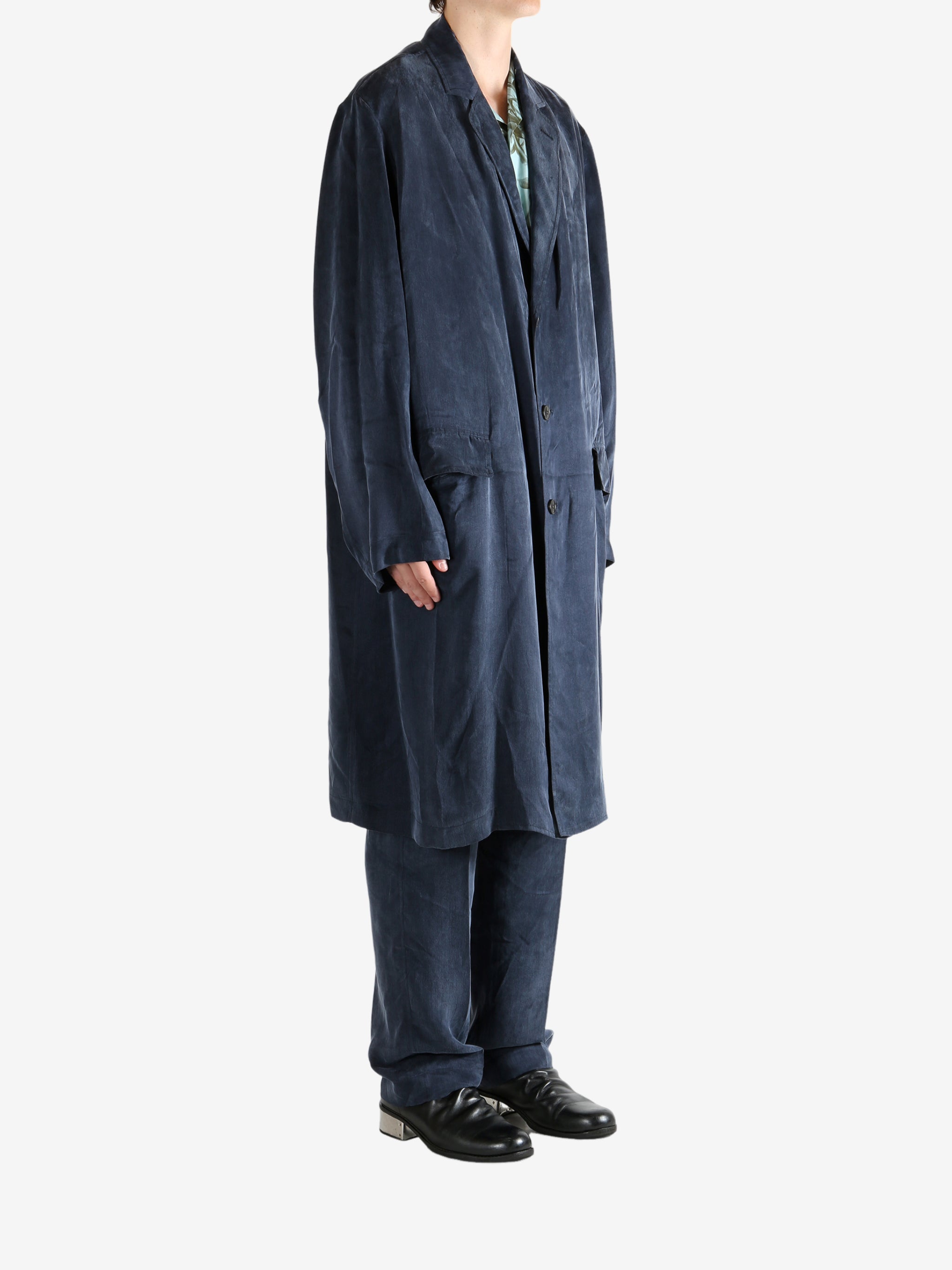 Navy coat worn by a person, showing the coat's fit