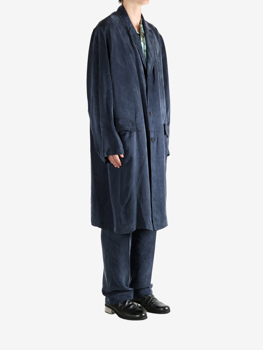 Navy coat worn by a person, showing the coat's fit