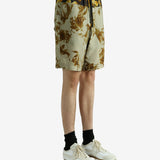 Green pants worn by a person, showing the pants' fit