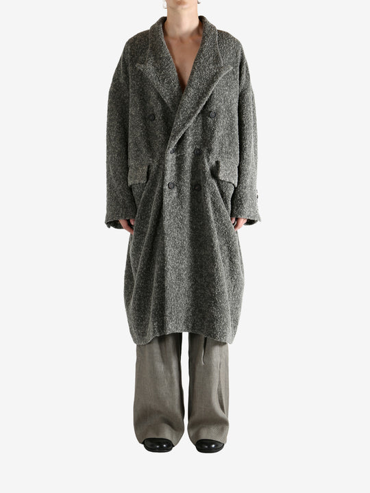 Grey coat worn by a person, showing the coat's fit