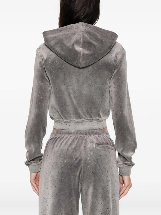 Grey hoodie worn by a person, showing the hoodie's fit