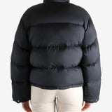 Black jacket worn by a person, showing the jacket fit