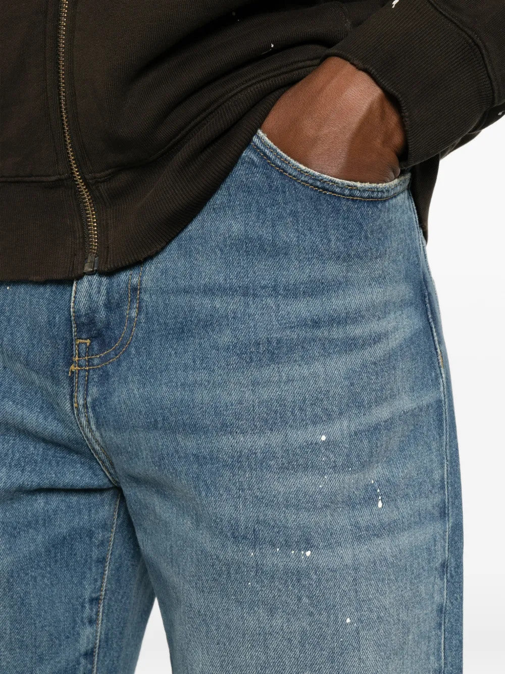 Blue pants worn by a person, showing the pants fit