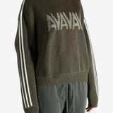 Brown sweater worn by a person, showing the sweater's  fit