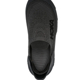 Black sneakers, vertical view