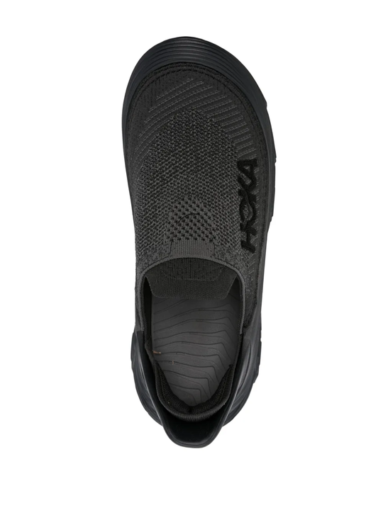 Black sneakers, vertical view