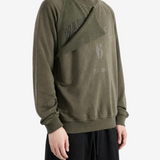 Green hoodie worn by a person, showing the hoodie fit