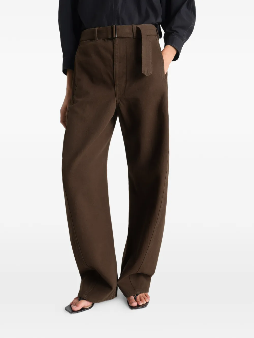 Brown pants worn by a person, showing the pants fit